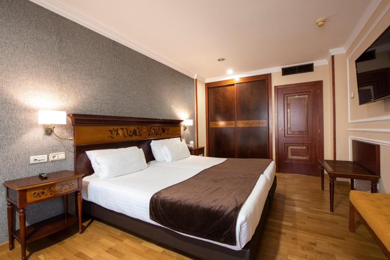 Hotel Eurostars Araguaney Santiago de Compostela Exterior foto A bedroom in a hotel